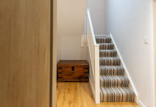 Stairs take you up to the first floor landing and further two bedrooms. 