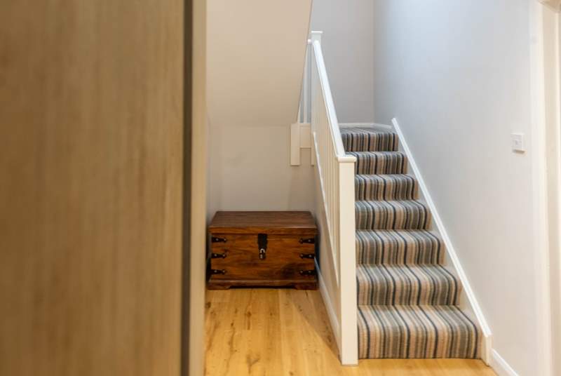 Stairs take you up to the first floor landing and further two bedrooms. 