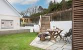 Ten decked steps lead down to the garden area, which is a lovely space to enjoy al fresco dining.  - Thumbnail Image