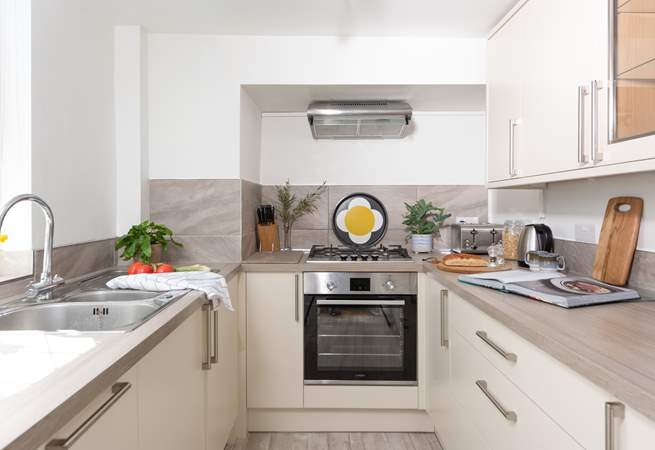 Small but perfectly formed, the kitchen is light and bright.