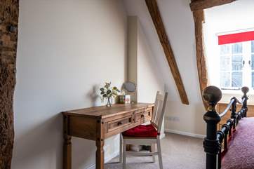 The desk in the bedroom is the perfect place to write a postcard, or perhaps catch up if work calls.