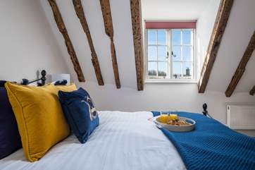 The gorgeous double bedroom has a king-size bed and mesmerising view.