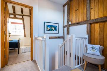 The turning staircase leads to the upper floor.
