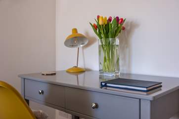 Sit at the desk and write a postcard, or perhaps catch up if work calls.