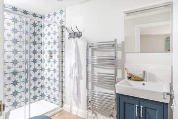 The en suite to bedroom 2 has a super rainfall shower to wash salty toes.
