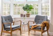 Relax in the bay window of this beautiful holiday home.