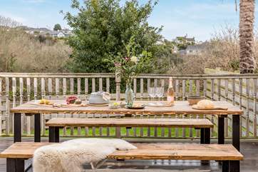The outside decking and garden is accessed either from a flight of stairs outside the property, or from the lower ground floor.