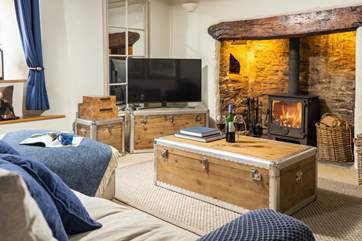 The fabulous feature fireplace with wood-burner for cosy nights in at any time of year.