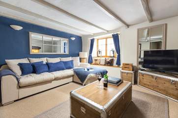Kick back and relax on the comfy sofa after a long day on the beach.