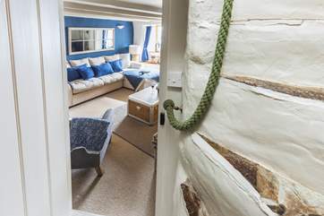 The feature staircase leads from the sitting-room.