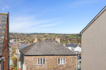 The view out of the living-room window. You can see out over Totnes and over the rolling countryside in the distance.