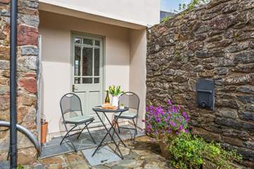 A lovely patio table set enables you to enjoy your charming surroundings.
