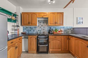 The kitchen offers oodles of space to whip up that feast.