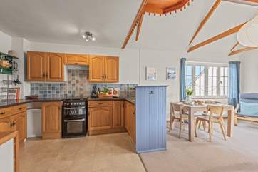 Whether you're cooking, dining, or relaxing, doing it together in this lovely open-plan space is a real pleasure.
