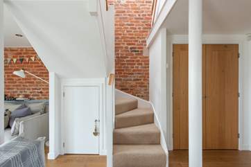 The stairs lead up from the open plan living room up to the three beautiful bedrooms