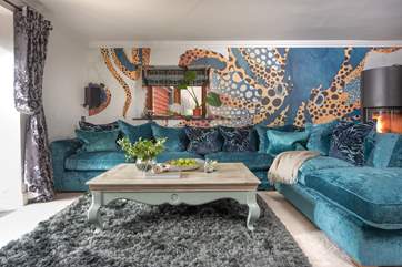 Wow! Statement wallpaper adds the finishing touch to the luxurious sitting-room.