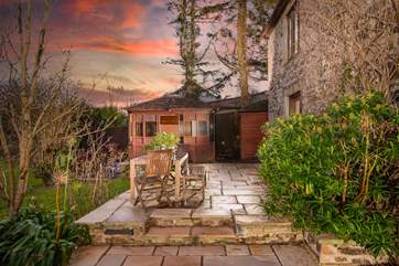 Two granite steps lead up to the terrace, from dawn until dusk enjoy the glorious outdoors here.