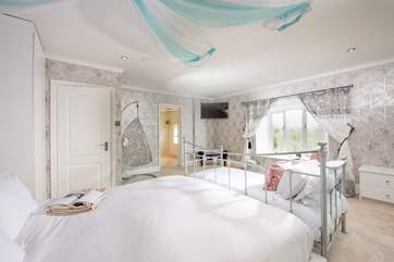 The dreamy principal bedroom gives you the choice of relaxing on the day bed or the hanging egg chair.