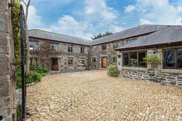 The pretty cobbled courtyard leading to the front door. This is also where you park your cars.