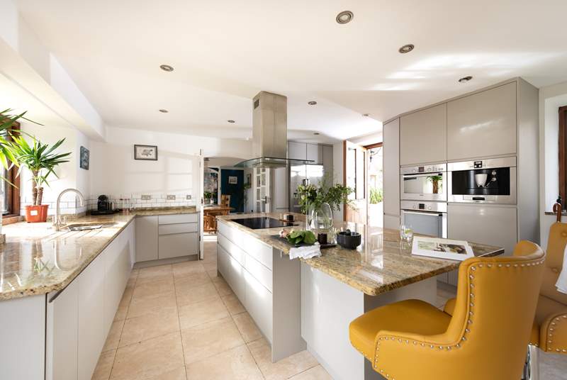 The super stylish kitchen has an electric oven and induction hob.