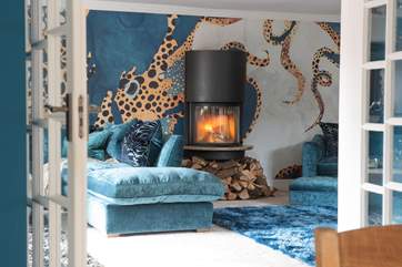 There is extra seating around the contemporary wood-burner which will keep you warm throughout the year.