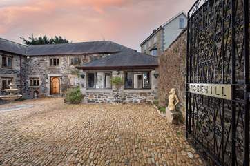 The Coach House Apartment overlooks a courtyard.