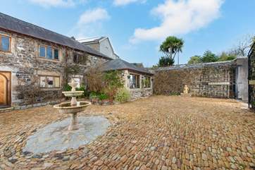 The Coach House Apartment overlooks this beautiful courtyard, which belongs to the house next door.