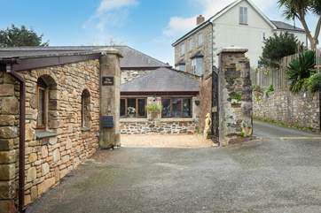 The front door is down the lane to the right of the Mews