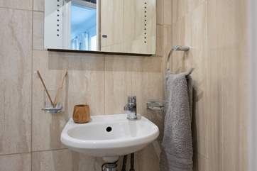 There is one step down to the shower-room and bedroom from the sitting-room.