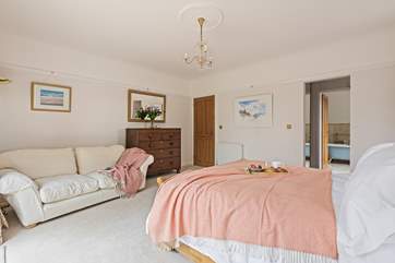 Bedroom 1 is super spacious and has a sofa, perfect for a quiet holiday read.