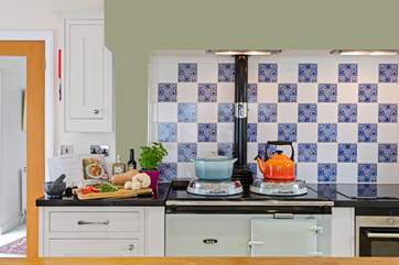 The traditional Aga adds character to the gorgeous kitchen.