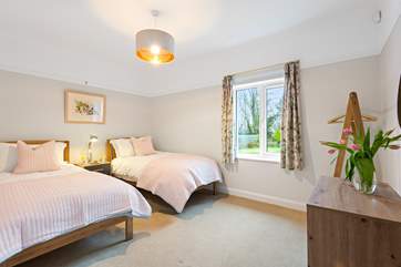 All on one level, the bedrooms at Moor-Tang all have lovely views of the beautiful garden. This twin room is bedroom 5.