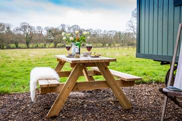 Dine al fresco with peaceful countryside views.