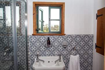 The lovely en suite has a shower, WC and sink.