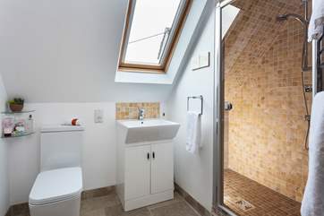 Bedroom Three has an En suite double shower with views overlooking the pretty garden.