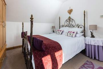 Sink into the cosy bed in Bedroom One.