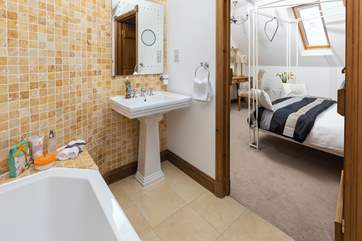 Bedroom Two's en-suite bathroom is a lovely place to enjoy a long soak.