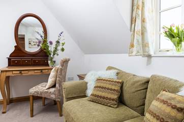 The sofa is a great spot to relax with a good book.