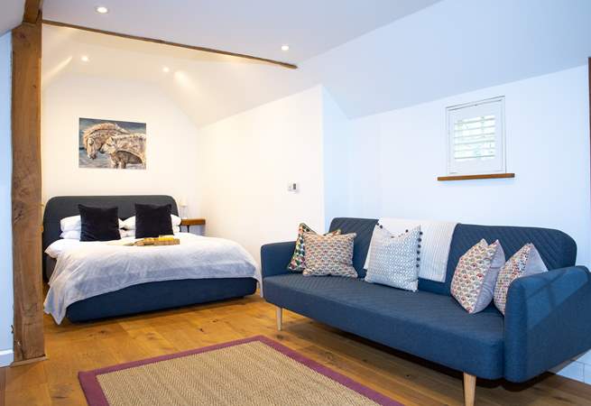 The gorgeous bedroom has oodles of space to relax and re-charge.