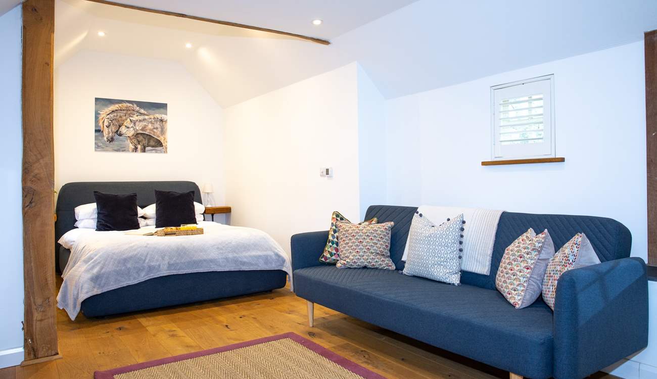 The gorgeous bedroom has oodles of space to relax and re-charge.