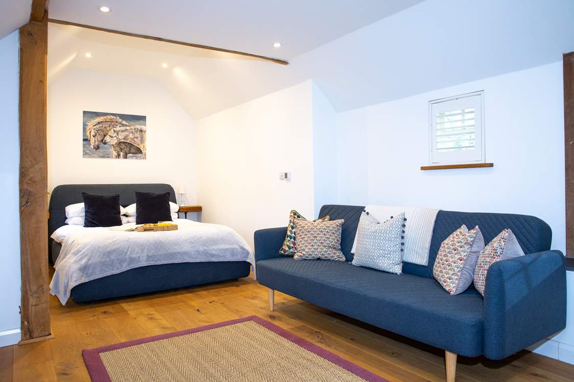 The gorgeous bedroom has oodles of space to relax and re-charge.