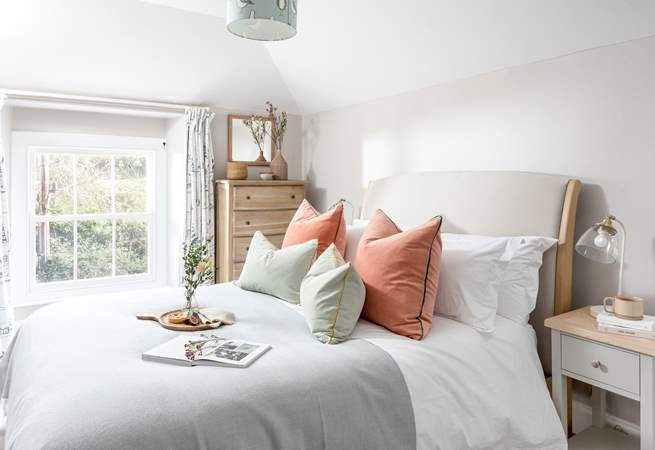 The cottage vibe continues in bedroom 2 with a comfy king-size double bed.