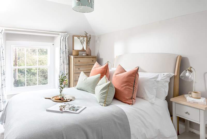 The cottage vibe continues in bedroom 2 with a comfy king-size double bed.
