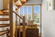 The stairs take you to the lower level where you will find the bedrooms.