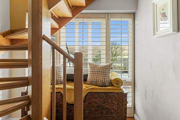The stairs take you to the lower level where you will find the bedrooms.