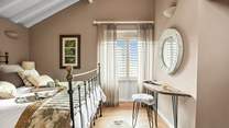 Bedroom two has beautiful high ceilings and luxurious finishing touches.
