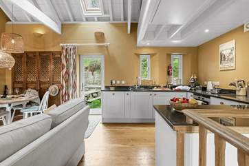 The open plan living area is on the first floor with a door to your own garden with picnic table.