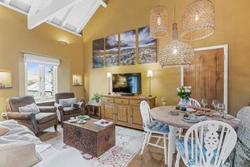 The open plan living-room is perfect for relaxing on holiday.