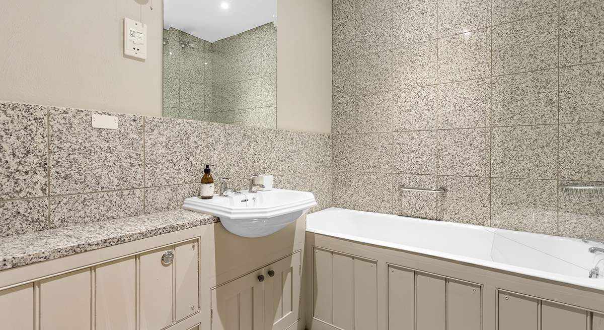 The family bathroom has both a shower and a bath, perfect for a long soak after a day of adventure.