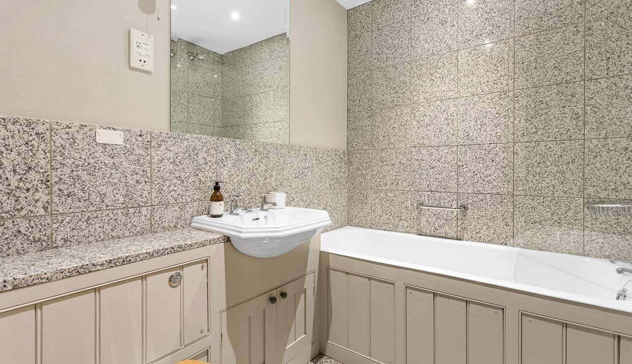 The family bathroom has both a shower and a bath, perfect for a long soak after a day of adventure.